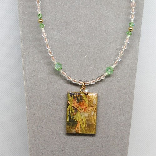 Necklace with a rectangular pendant featuring a floral design on a gray background