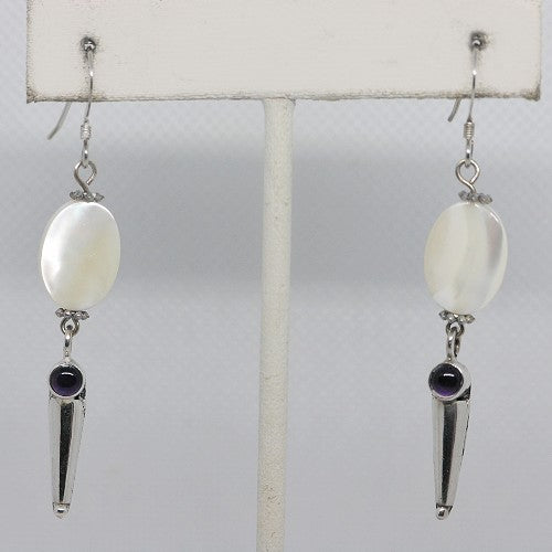 Pair of earrings with mother of pearl, amethyst and silver accents on a white background