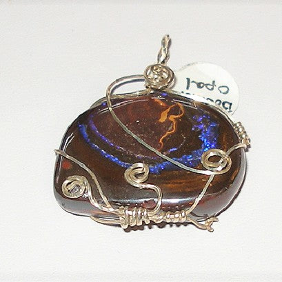 Pendant with wire wrapping on a white background