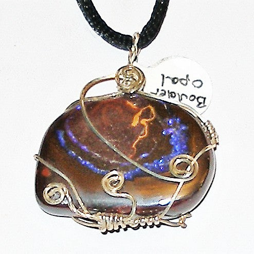 Necklace with a large, multicolored stone pendant on a white background