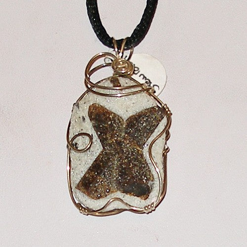 Natural stone pendant with wire wrapping on a white background