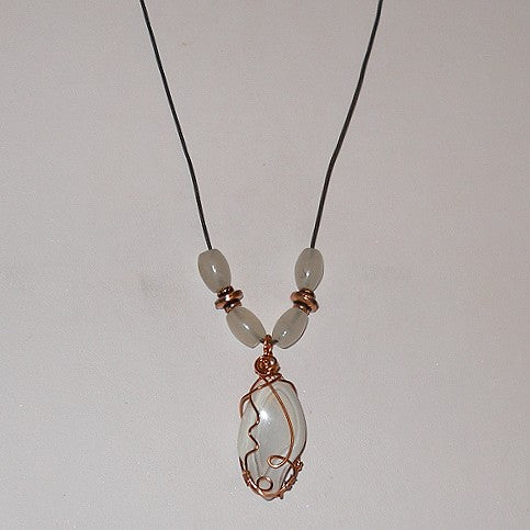 Necklace with a pendant featuring a wire wrap design on a white background