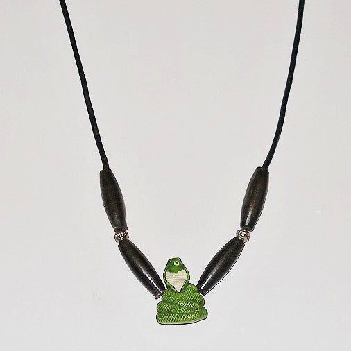Necklace with a green snake pendant on a white background
