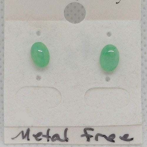 Green oval earrings on a metal-free earring card.