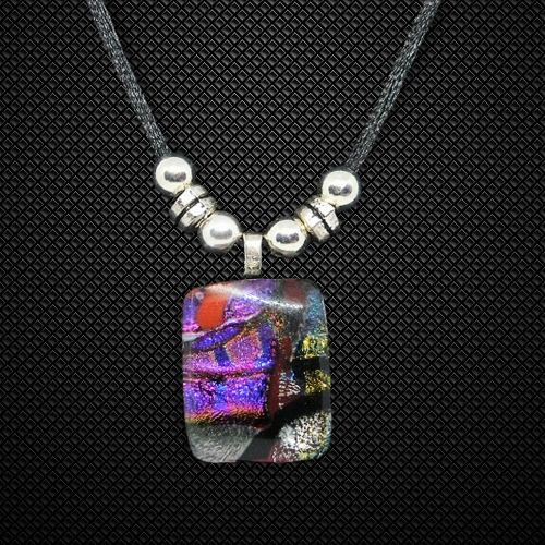 Necklace with a colorful rectangular pendant and silver beads on a black background