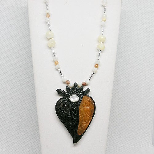 Necklace with a heart-shaped pendant on a white background