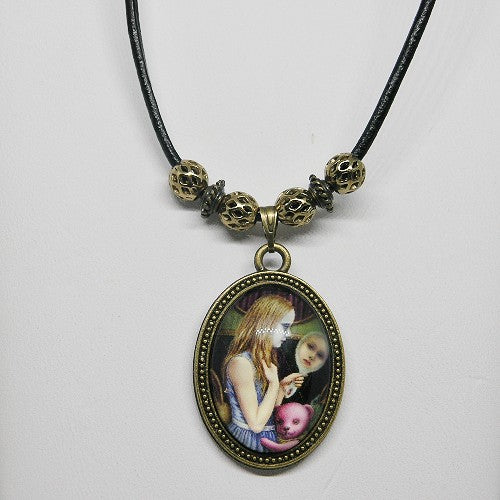 Necklace with a pendant featuring a woman and a teddy bear on a white background