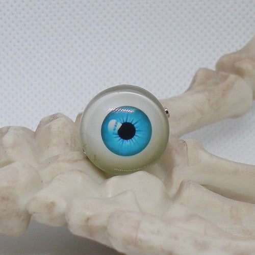 Blue artificial eye on a white background