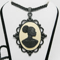 Cameo necklace with a profile of a woman on a white background