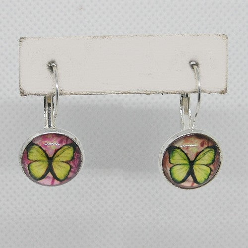 Butterfly-themed earrings on a white card with a gray background