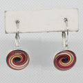 Colorful spiral earrings on a white background