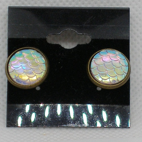 Pair of earrings with iridescent fish scale design on a black card.