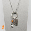 Necklace with charms on a gray background