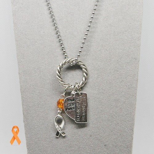Necklace with charms on a gray background