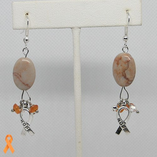 Pair of earrings with peach-colored stones and 'hope' charms on a white background
