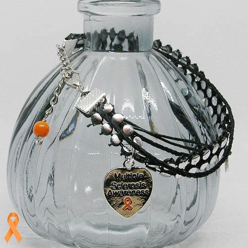 Glass bottle with multiple bracelets and a heart-shaped Multiple Sclerosis Awareness charm on a white background