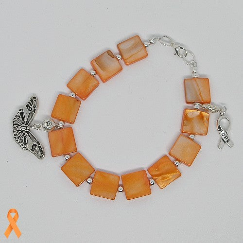Bracelet with orange square beads and silver charms on a light gray background