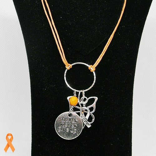 Necklace with pendant on a black stand, featuring an orange ribbon symbol.