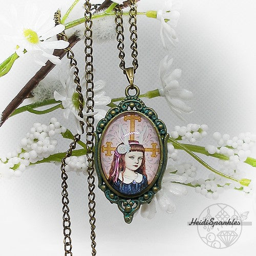 Vintage-style pendant necklace with a portrait design on a white floral background