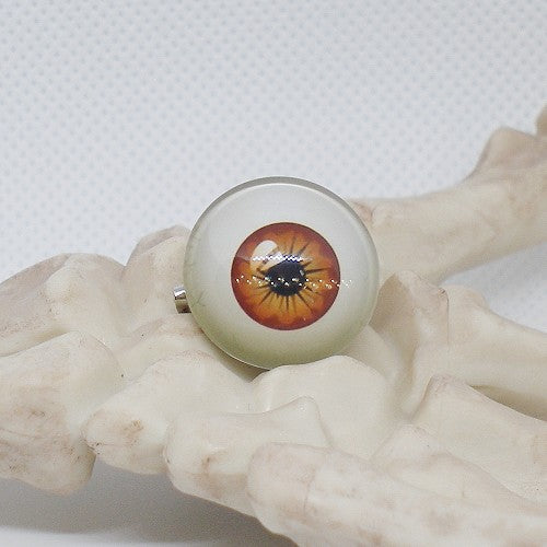 Eyeball-shaped object on a textured surface