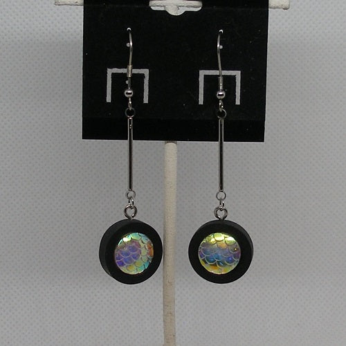 Pair of earrings with colorful textured dangles on a gray background
