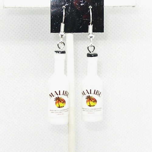 Malibu coconut bottle cap earrings on a white background