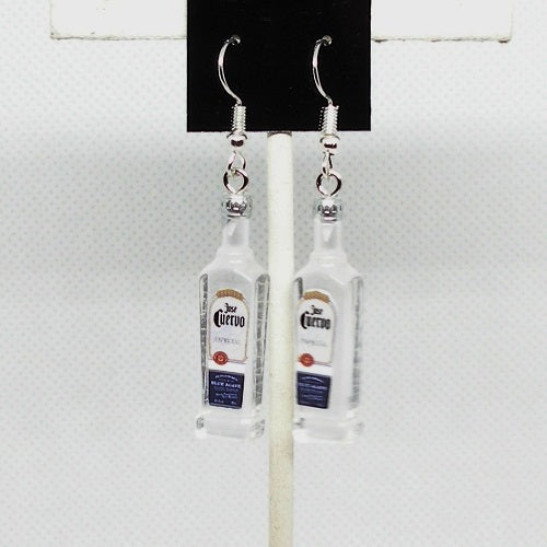 Tequila bottle-shaped earrings on a white background