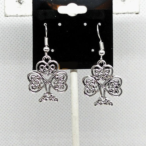 Silver shamrock earrings on a card with a white background