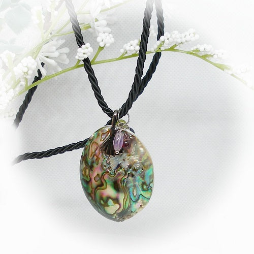 Necklace with a colorful shell pendant and beads on a white background