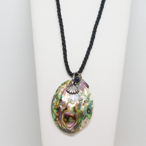 Necklace with a colorful shell pendant on a white background