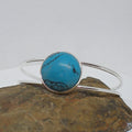 Turquoise stone bracelet on a textured surface