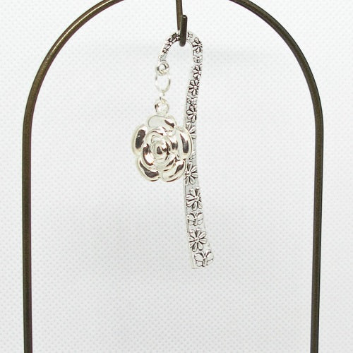 Silver floral metal bookmark on a white background