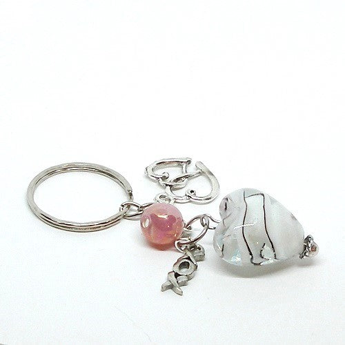 Keychain with heart-shaped charm, pink bead, and silver accents on a white background