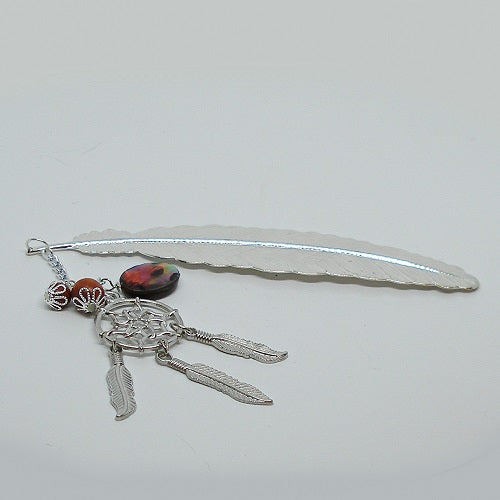 Silver feather with dreamcatcher charm on a white background